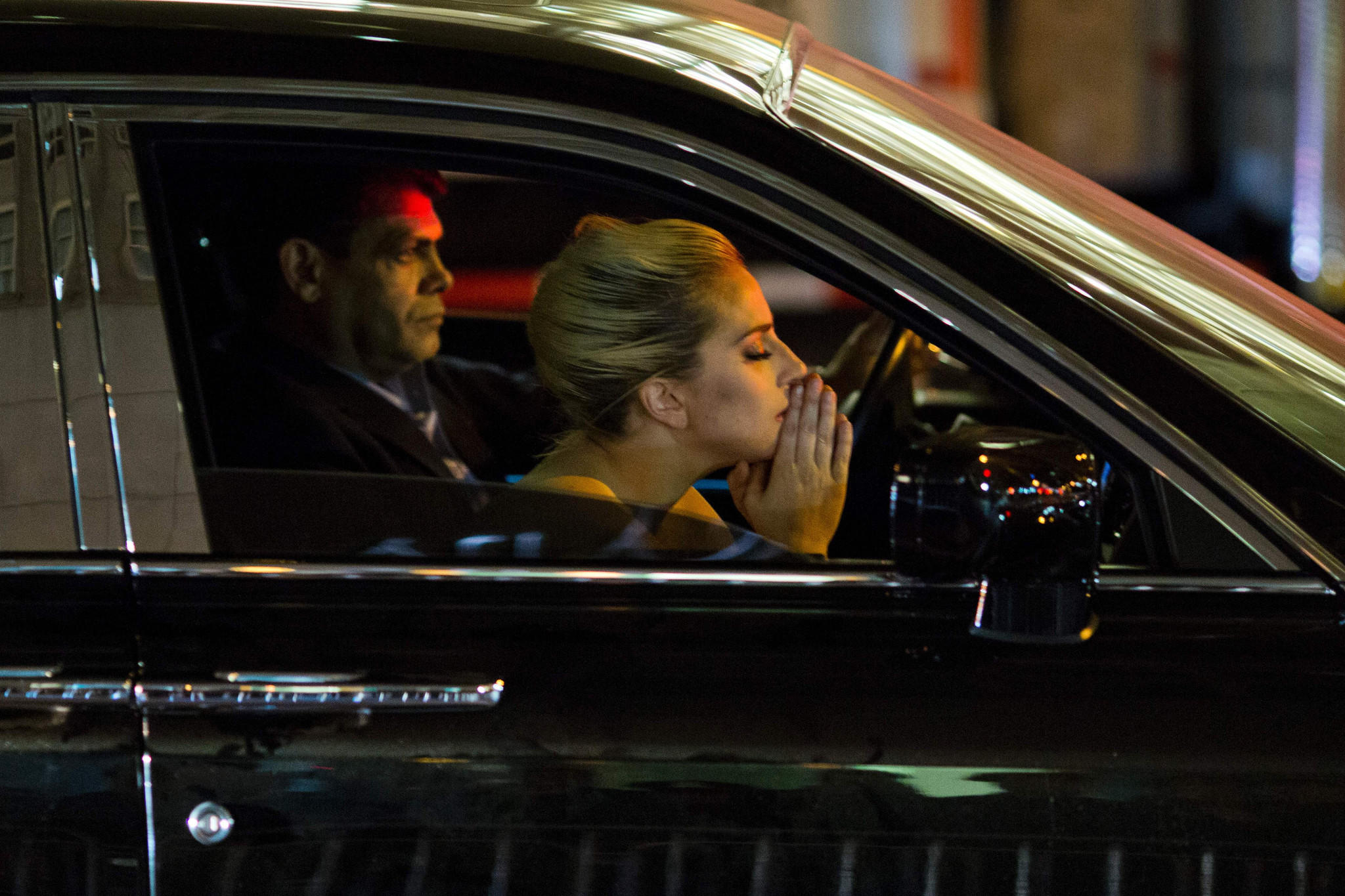 Lady Gaga sits in her car after staging a protest against Donald Trump outside Trump Tower. (Dominick Reuter / AFP/Getty Images)
