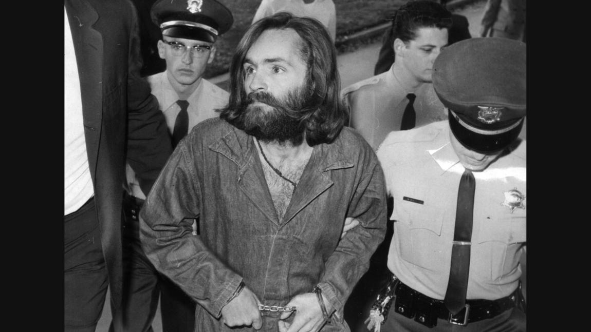 Charles Manson is escorted to court for a preliminary hearing in 1969.
