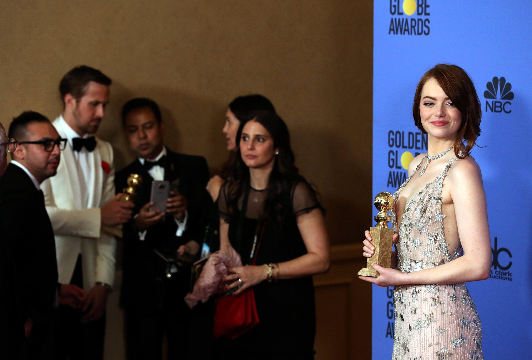 Emma Stone with her Golden Globe Award. (Mike Nelson / EPA)