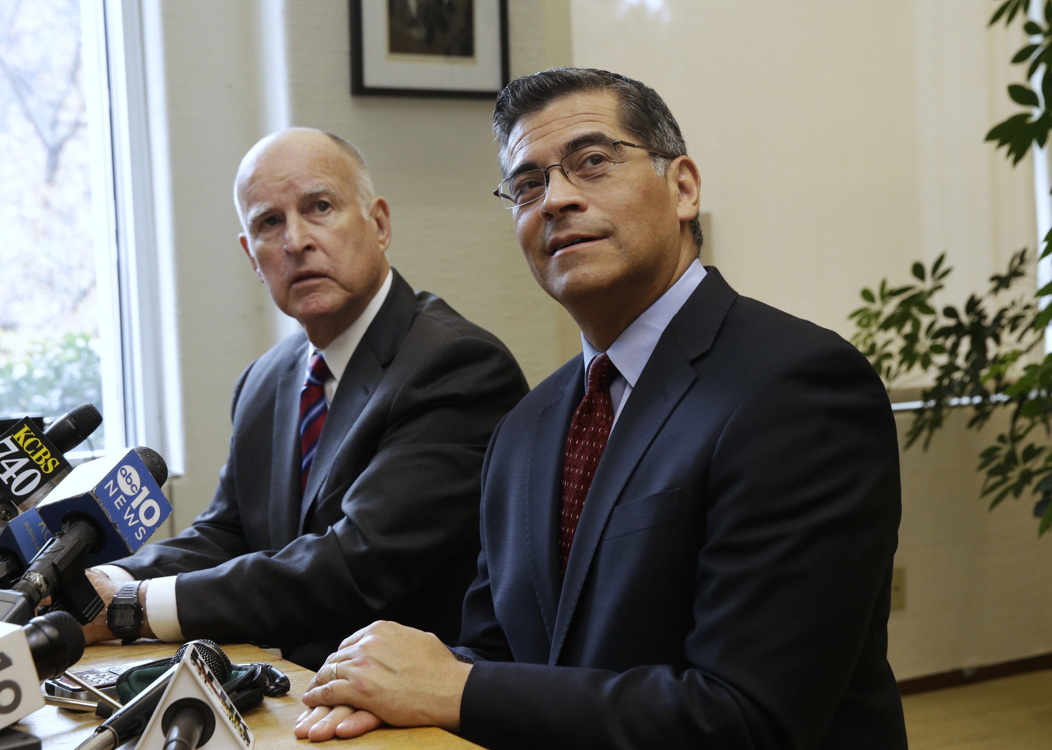Gov. Jerry Brown, left, and Atty. Gen. Xavier Becerra. (Rich Pedroncelli/Associated Press)