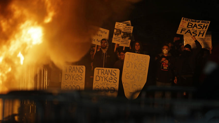 Protesters watch a fire on Sproul Plaza during a rally against a scheduled appearance in February by Milo Yiannopoulos at UC Berkeley.