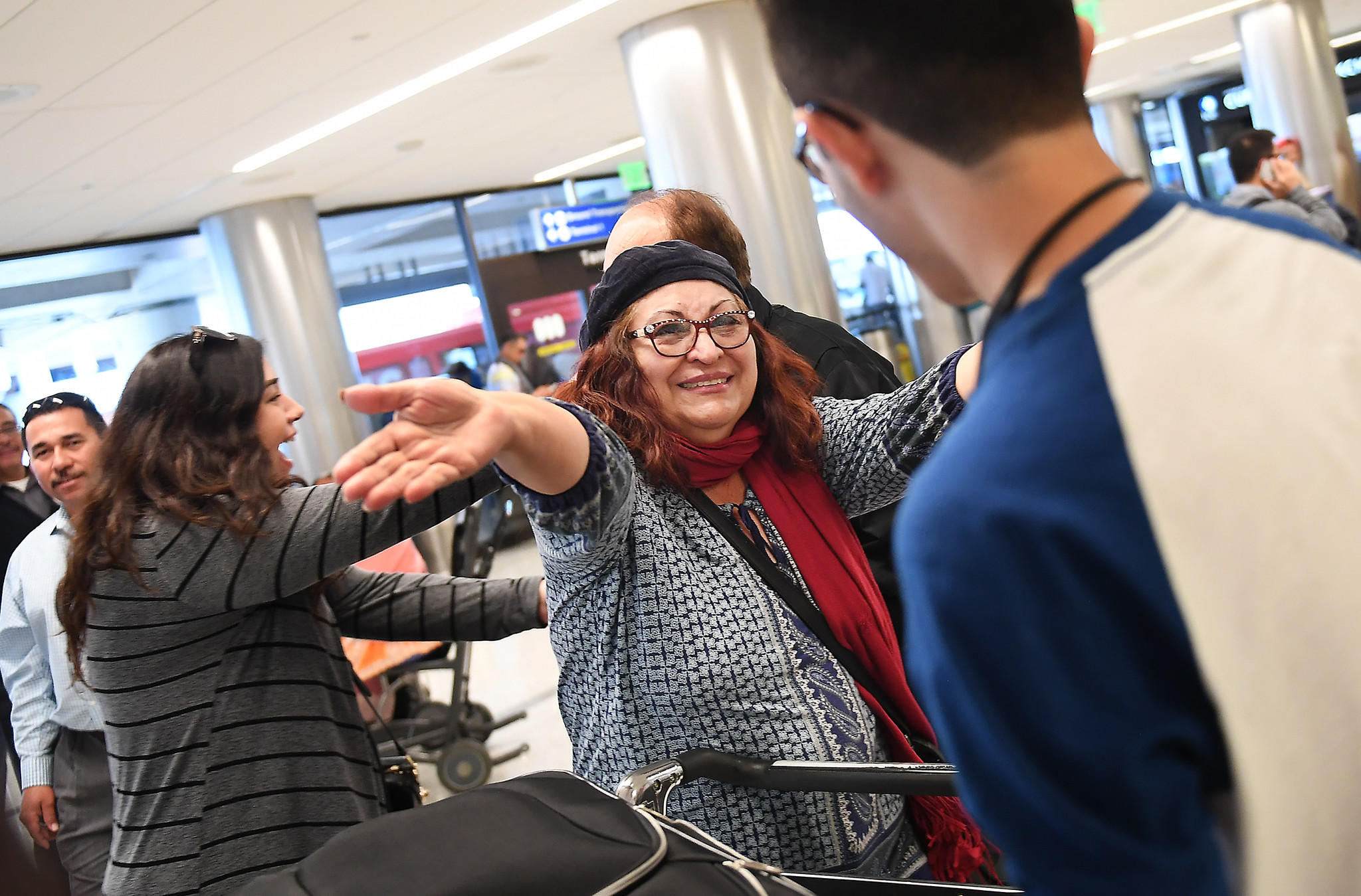 Alicia Gomez, 60, greets her son Mauricio, now 17, after he arrived at LAX from El Salvador.