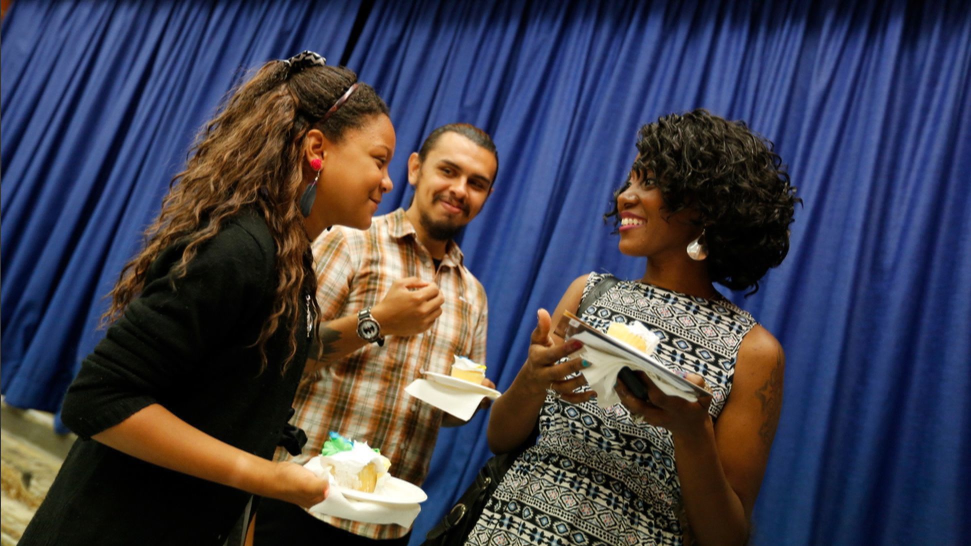 Angelica, Sanchez and Baker enjoyed cake after a reception following Angelica's sixth grade graduation.