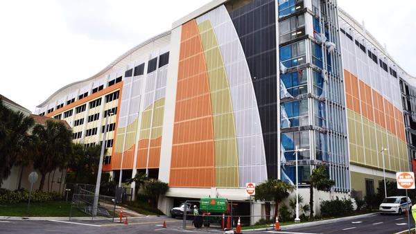 The new parking garage at the Palm Beach County Convention Center is decorated with colorful panels.