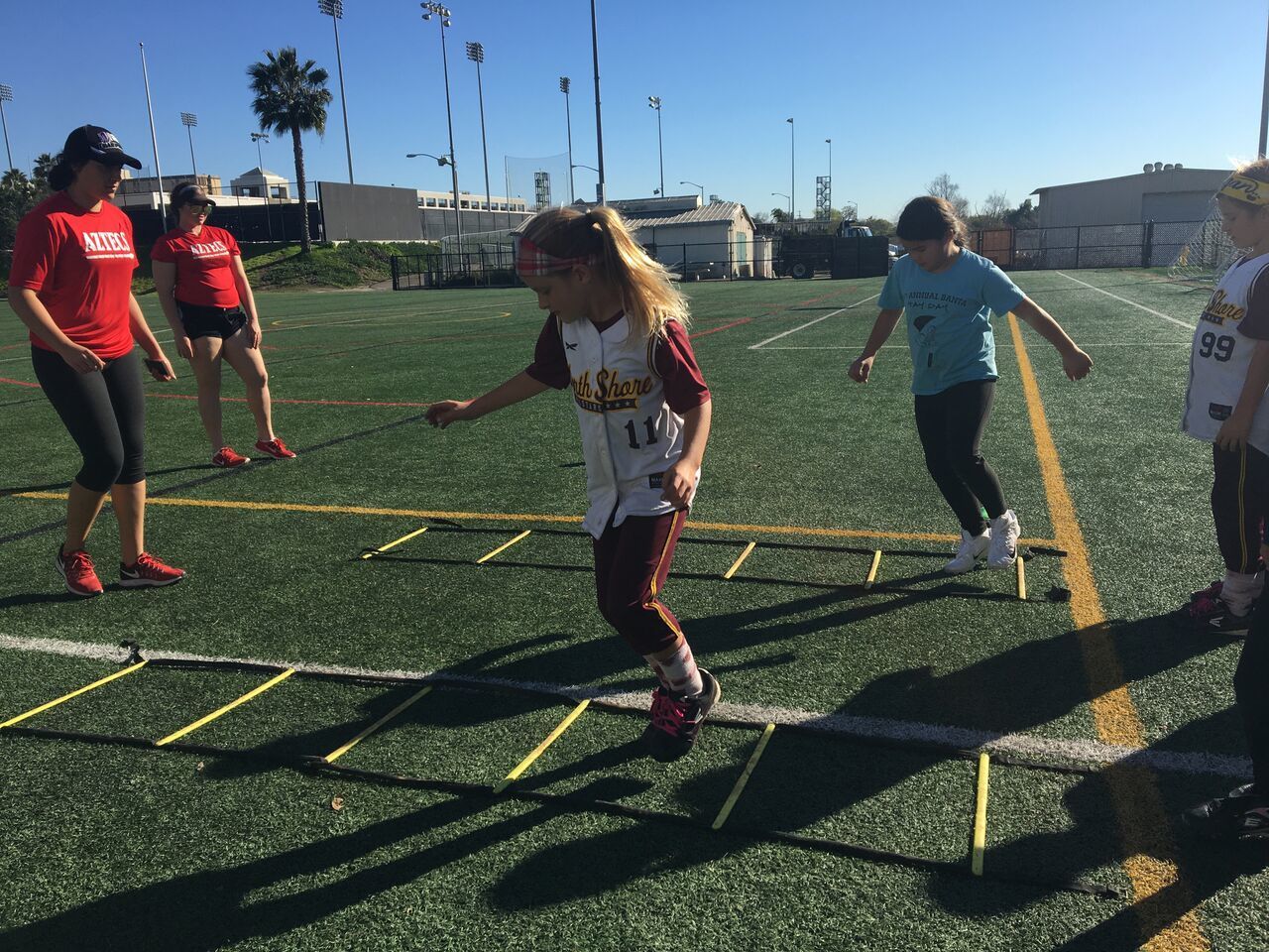 More than 50 girls participated in a variety of drills that were designed to develop and hone softball skill and technique.