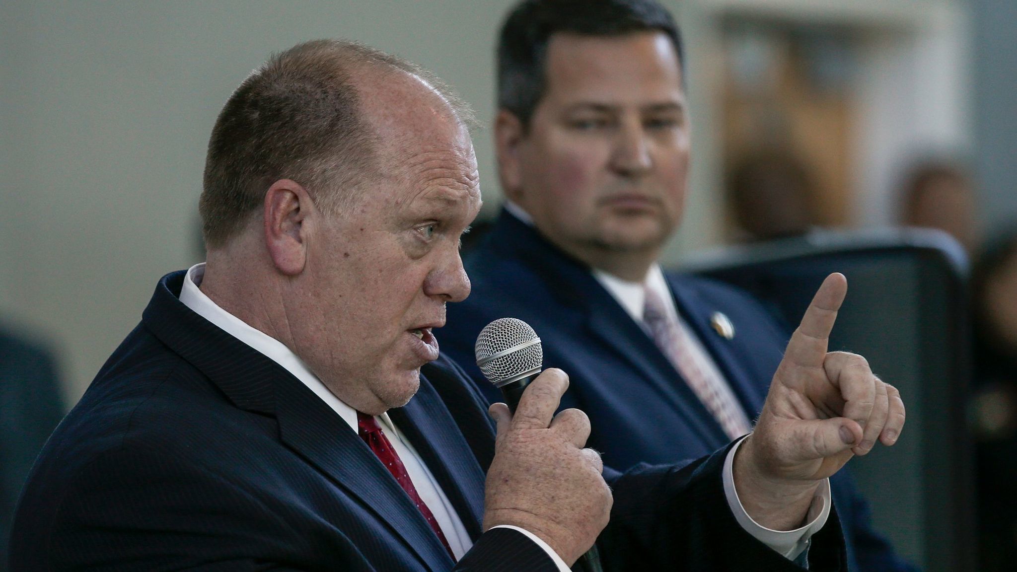 Hundreds of Sacramento residents protested, listened and shouted while acting ICE Director Thomas Homan, left, and Sacramento County Sheriff Scott Jones held a community forum.