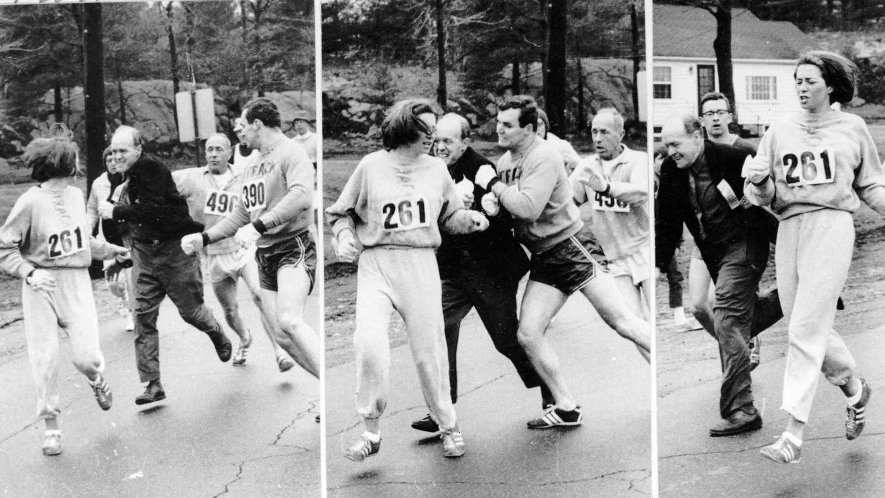 Boston Marathon official Jock Semple tries to eject Kathrine Switzer (261) in 1967, but Tom Miller runs interference and blocks him out.