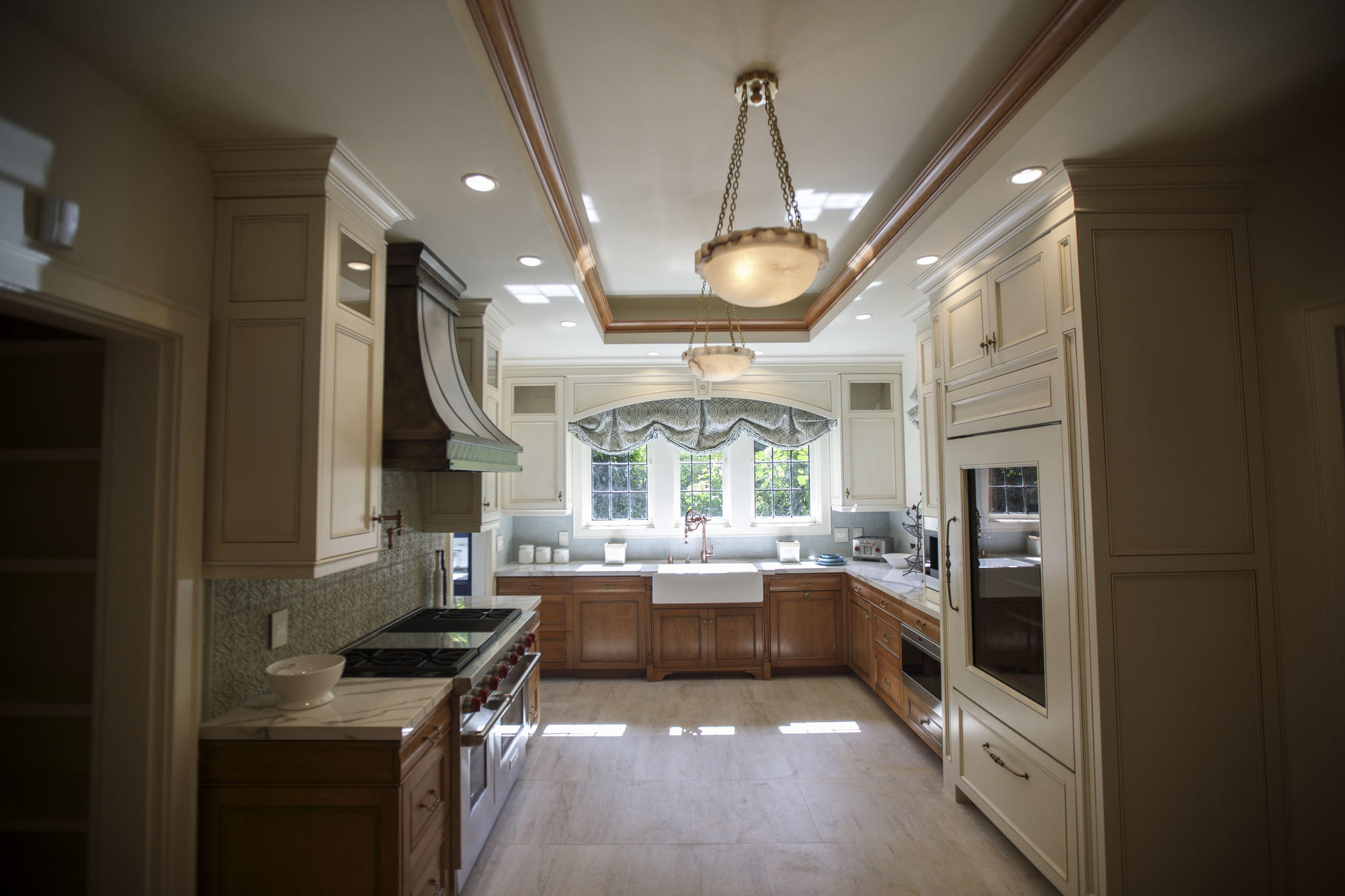 The kitchen by D Christjan Fine Cabinetry Design & Manufacturing, after renovations.