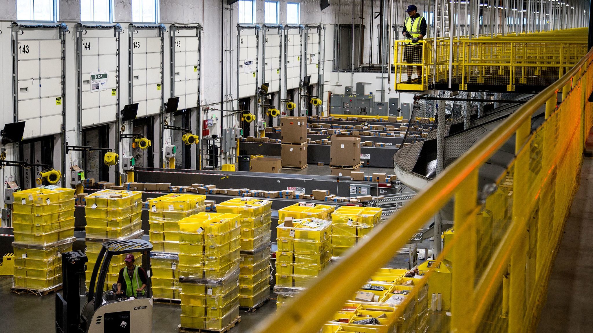 Packages move along a conveyor belt at the Amazon Fulfillment Center in San Bernardino