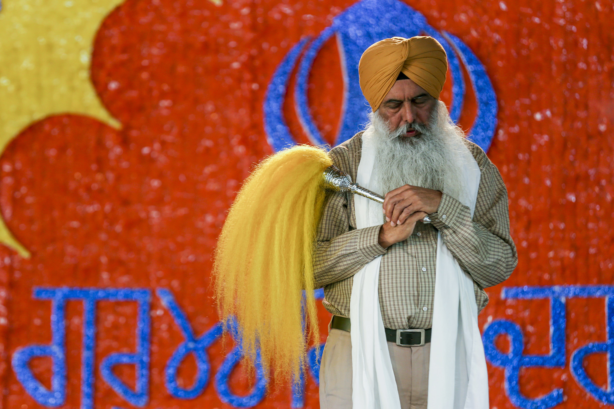 A Sikh priest offer prayers during Nagar Kirtan services at Gurdwara Guru Angad Darbar in Bakersfield.