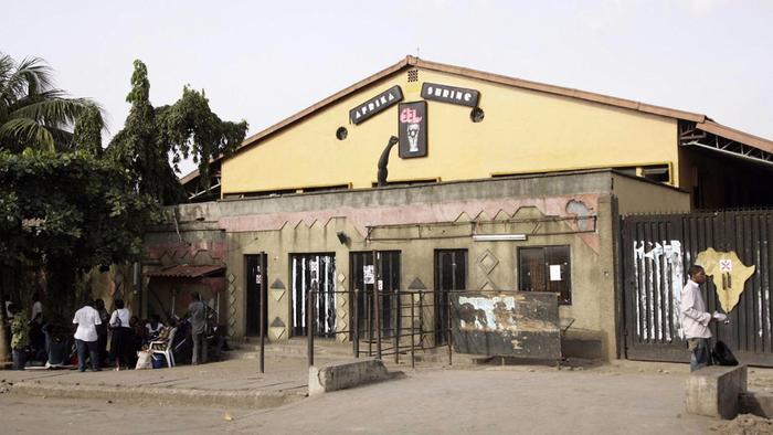 People hang out outside the new Africa Shrine, a music venue built and owned by Femi Kuti, a son of