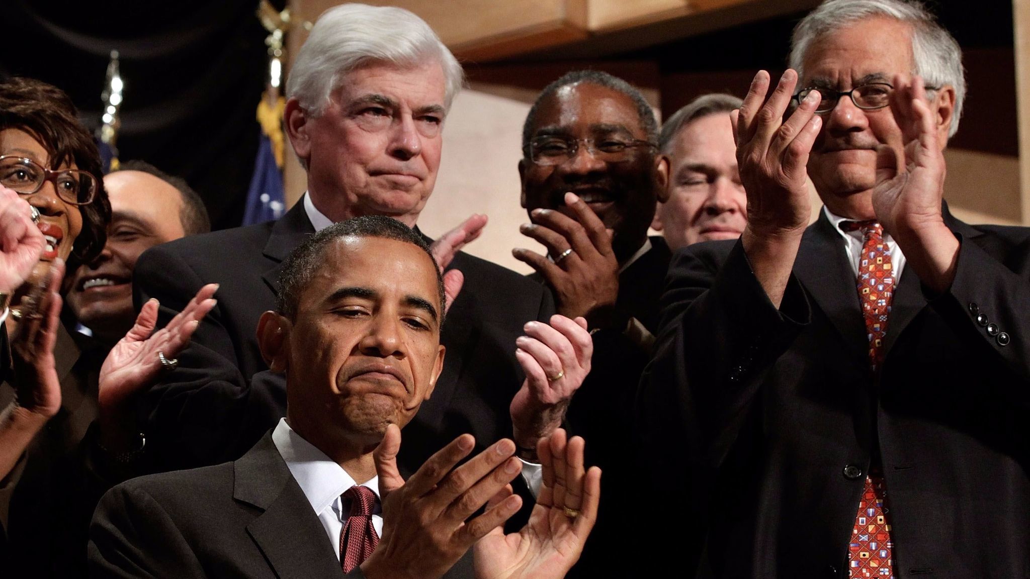 President Barack Obama applauds after signing the the Dodd-Frank financial reform bill into law in 2010, joined by Senate Banking Committee Chairman Christopher Dodd (D-Conn.), center, and  House Financial Services Committee Chairman Barney Frank (D-Mass.), right.
