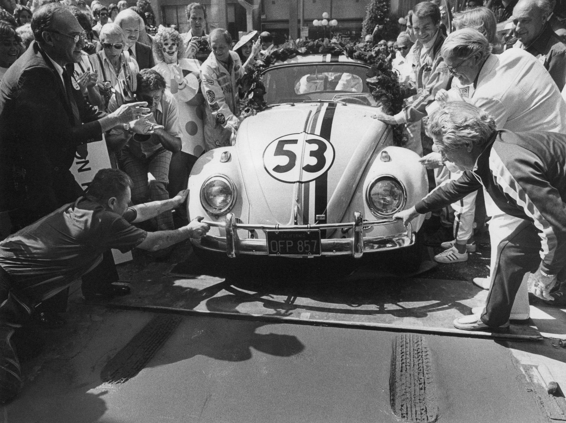 Herbie the love bug leaves a tireprint in the wet cement at the Chinese Theatre in Hollywood for the opening of "Herbie Goes to Monte Carlo," in 1977.