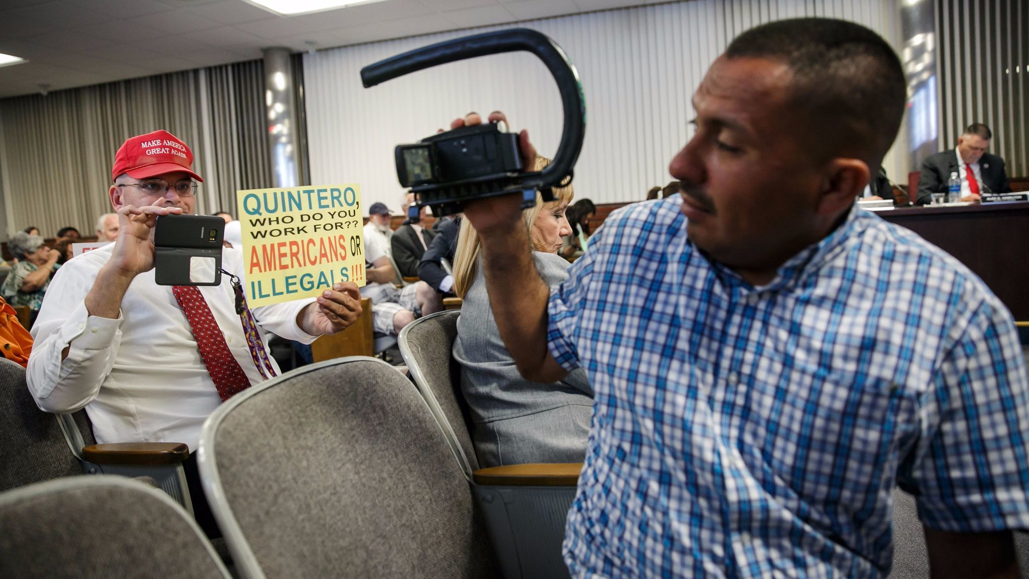 Schaper and immigrants' rights activist Naui Huitzilopochtli point their cameras at each other. Huitzilopochtli, of Santa Ana, often shows up at events specifically to record Schaper and other anti-illegal immigrant activists.