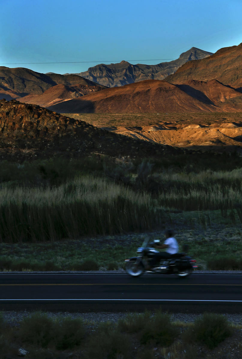 A motorcyclist rides along Highway 127 in Shoshone.