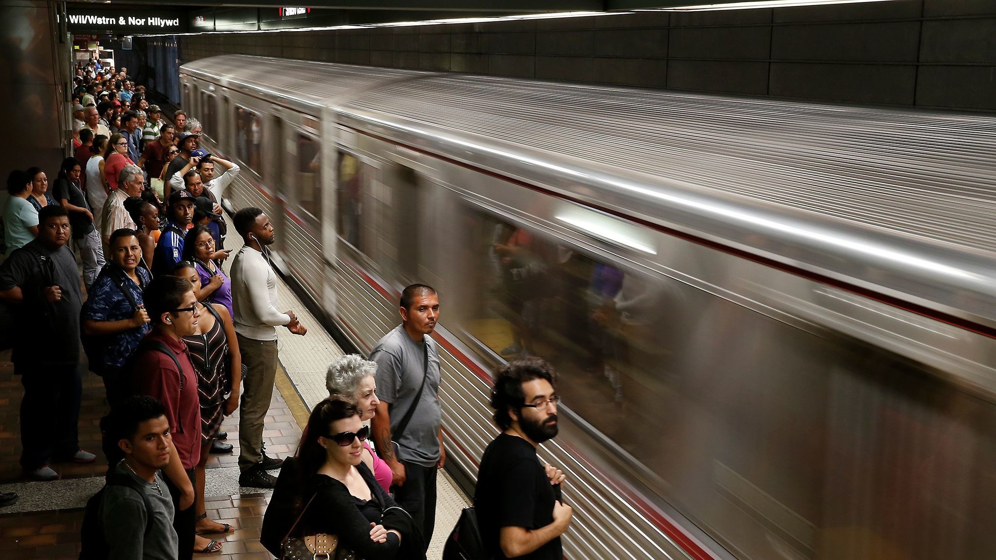 An eastbound train pulls in as commuters wait to board at the 7th Street Metro subway station in 2014.