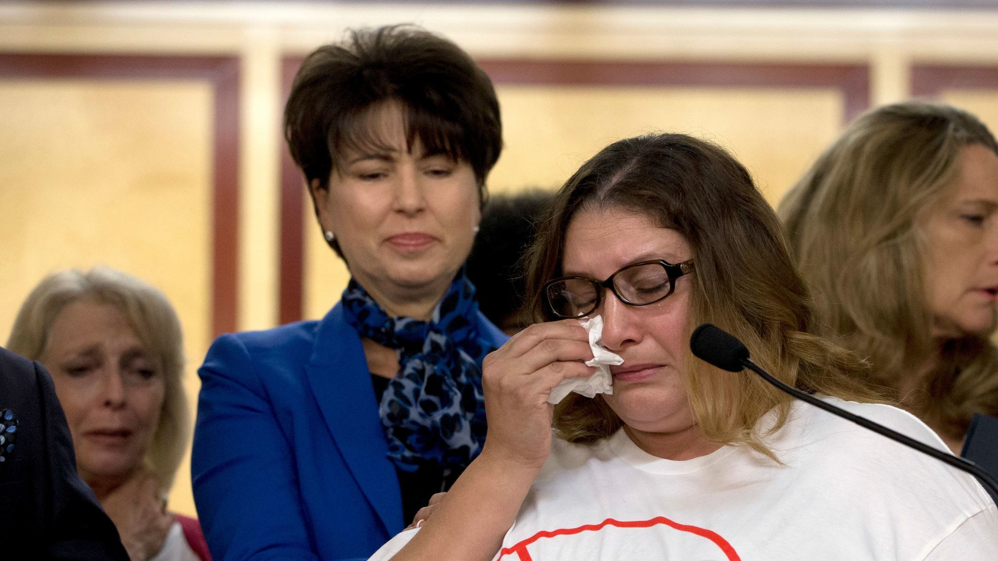 Norma Hernandez, backed by state Sen. Connie Leyva (D-Chino), wipes her eyes as she talks at a September 2016 news conference about being raped when she was 13. Leyva sponsored a bill that ended California's statute of limitation in some rape cases.