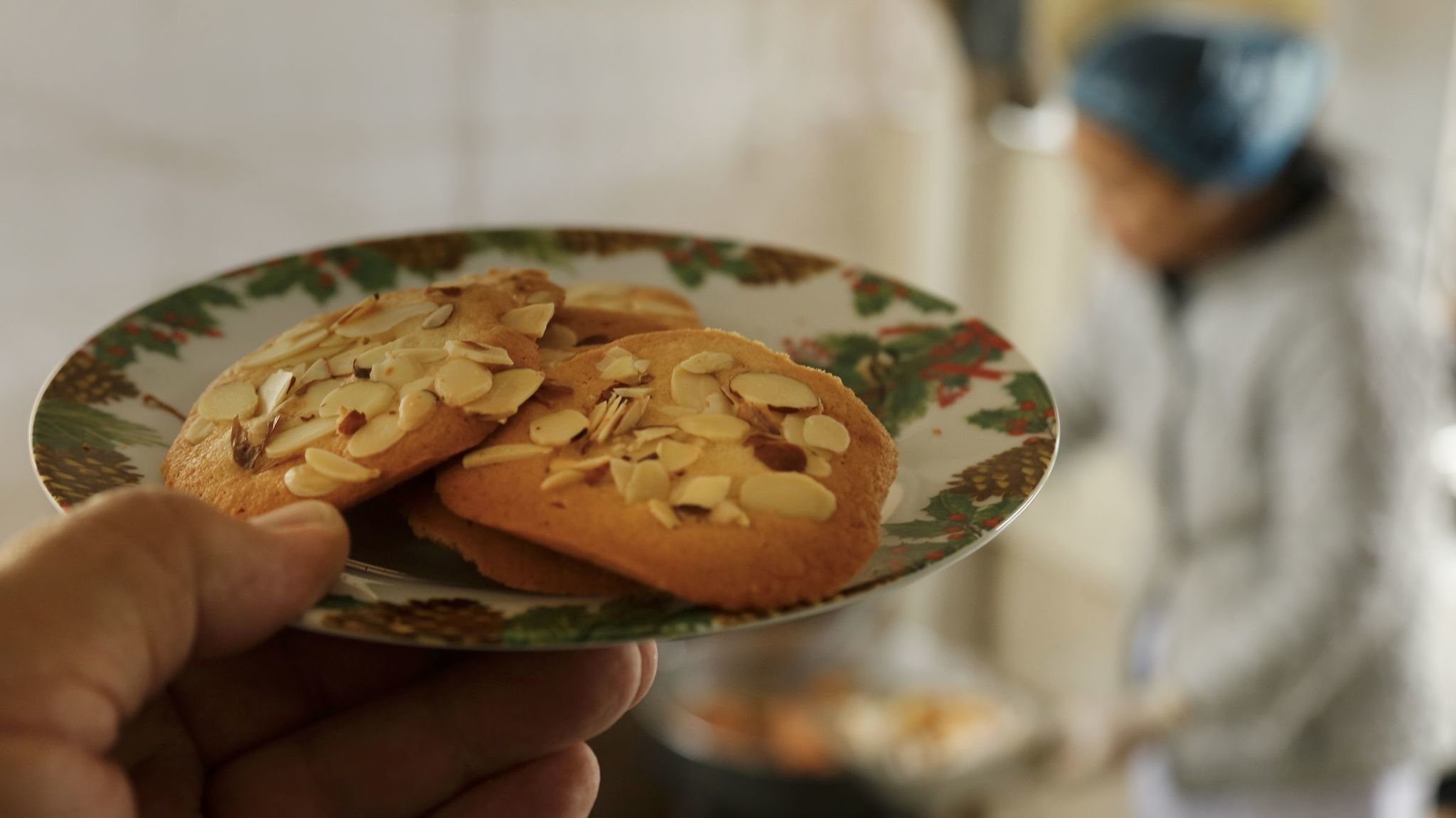 Crispy almond cookies add to Hue Phan's repertoire, baked before the meals are delivered..