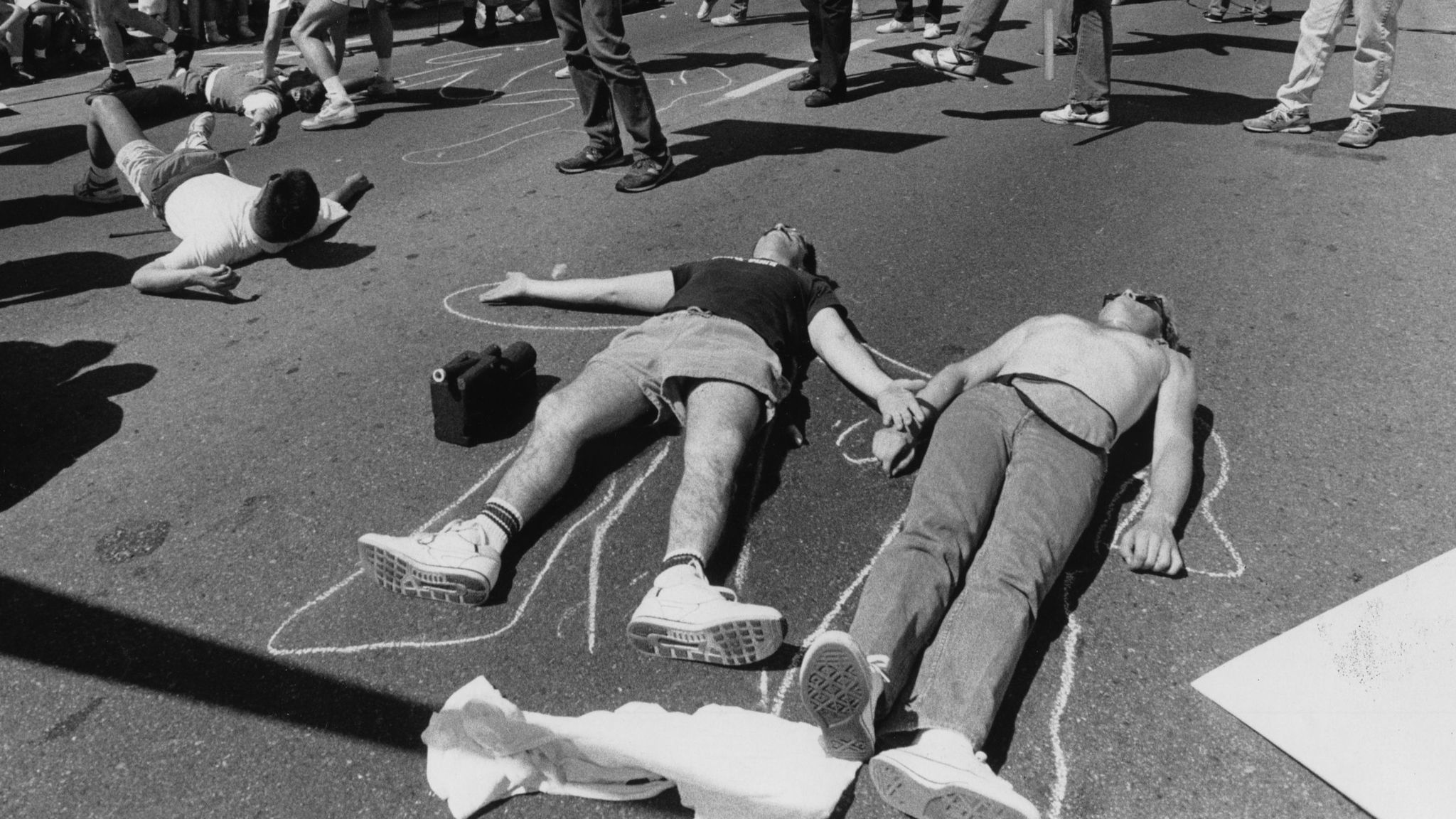 Parade participants stage a die-in at San Vicente and Santa Monica Boulevard.