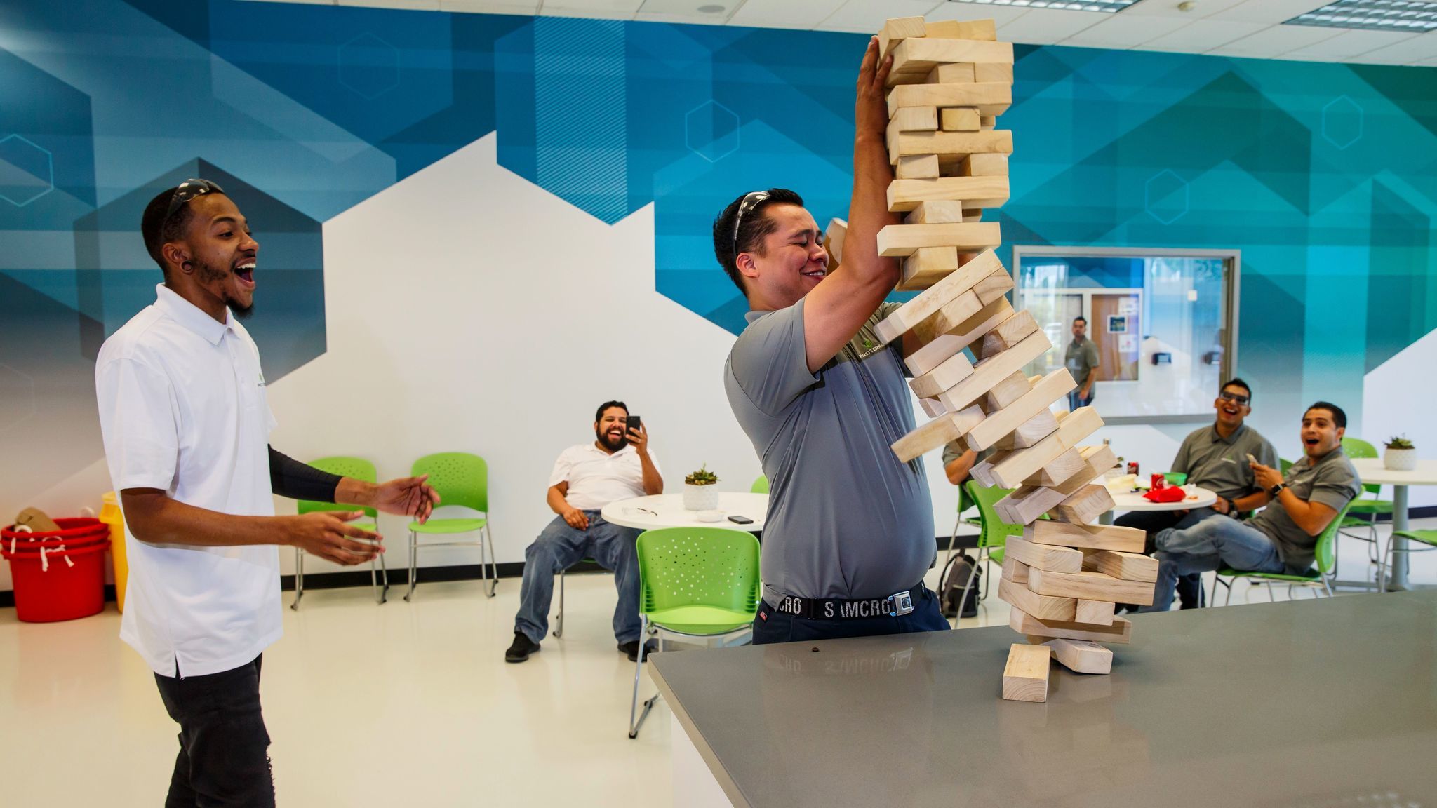 Derik Stone and Manny Almanza play giant Jenga on their lunch break. Proterra gives them 45 minutes.