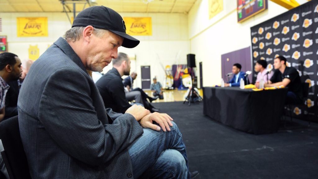 Lakers co-owner Jim Buss listens to draft pick D'Angelo Russell speak to the media during is introduction on June 29, 2015.