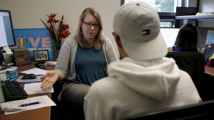 Attorney Amy Frances Barnett, left, advises a UC Davis student at the UC Immigrant Legal Services Center at UC Davis. (Francine Orr/ Los Angeles Times)