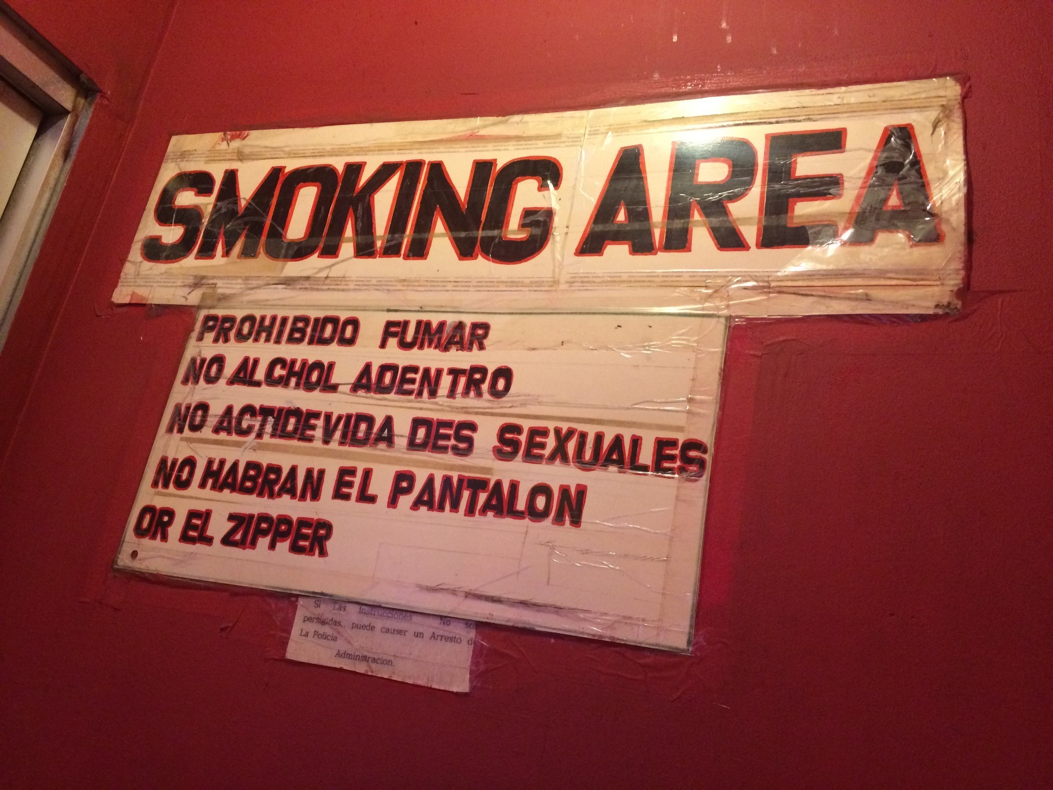 A sign in crude Spanish at the Tiki advises patrons to keep it zipped.