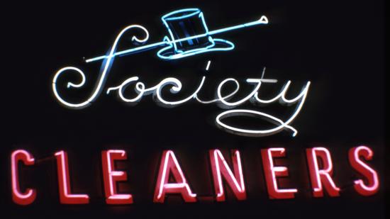 A dapper neon sign that once encouraged customers to have their clothes cleaned at Society Cleaners