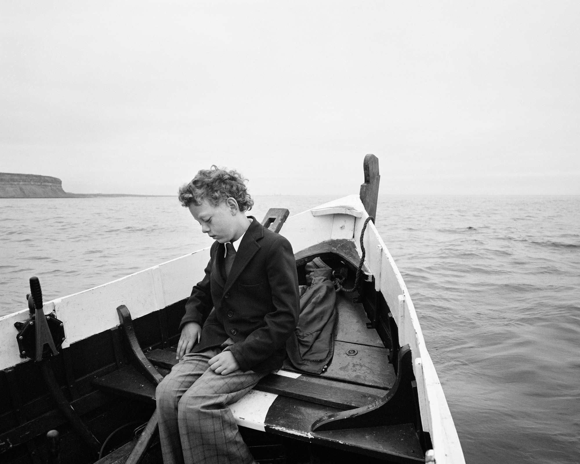 "Simon Being Taken Out to Sea for the First Time Since his Father Drowned, Skinningrove," 1983, by Chris Killip.