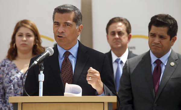 Atty. Gen. Xavier Becerra, left, and Rep. Jimmy Gomez speak about immigration at Cal State L.A. (Mel Melcon / Los Angeles Times)