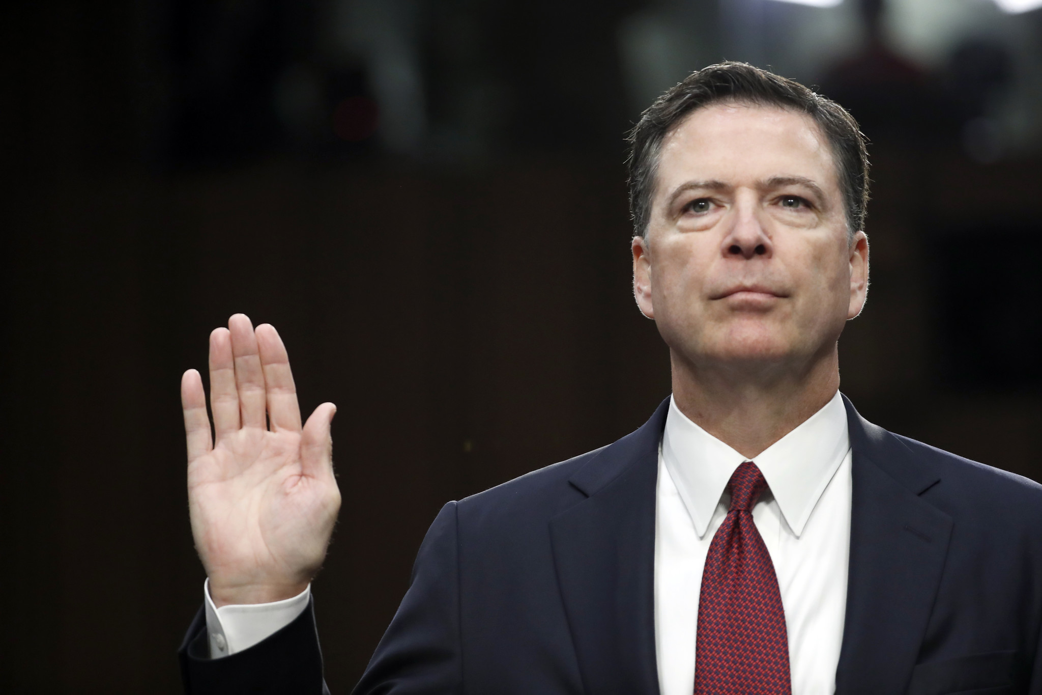 Former FBI Director James Comey is sworn in during a hearing before the Senate Select Committee on Intelligence in June.