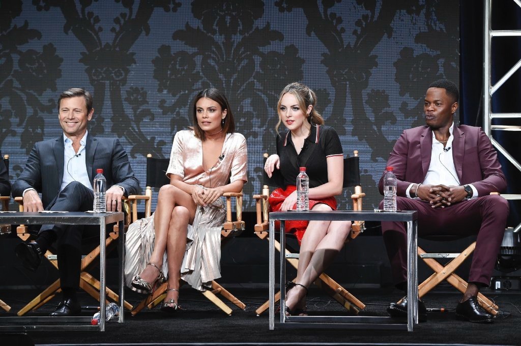 The cast of CW's reboot of "Dynasty," from left: Grant Show, Nathalie Kelley, Elizabeth Gillies and Sam Adegoke. (Richard Shotwell / Invision)
