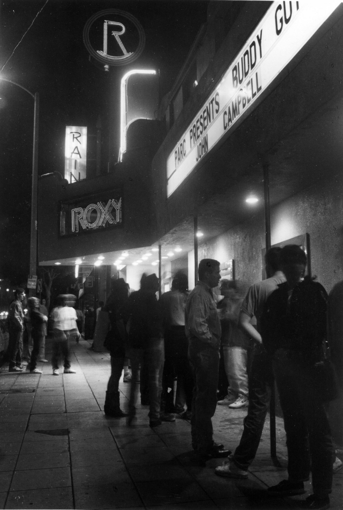 People gather outside the Roxy Theater in  1991.