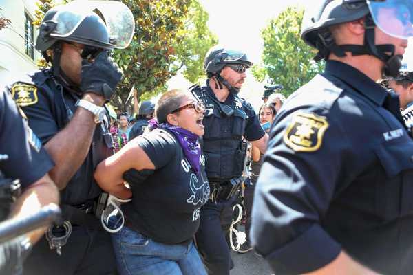 Berkeley police officers make arrests during protests several weeks ago.