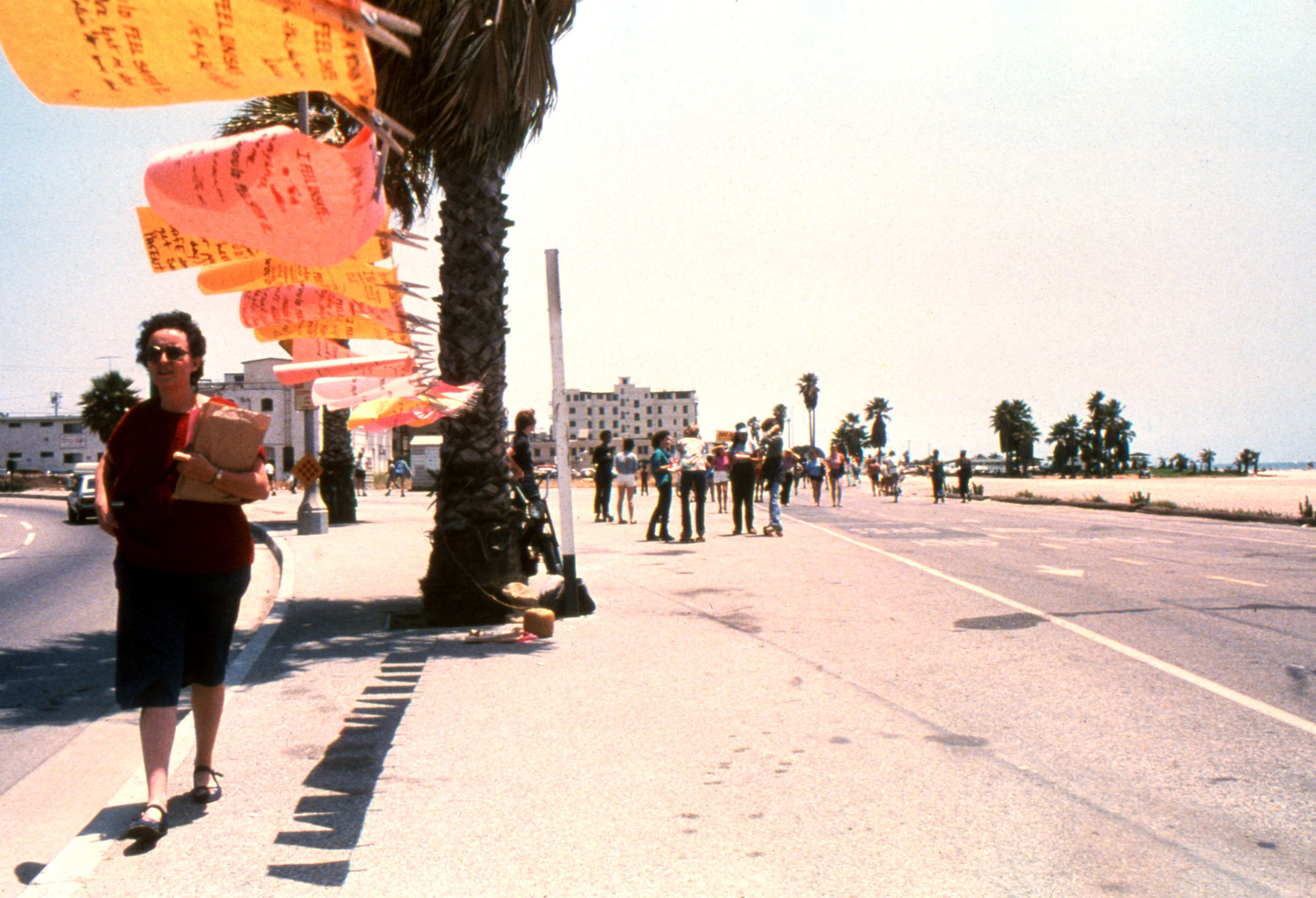 Mónica Mayer walks along the installation of "El Tendedero" in Los Angeles in 1979.