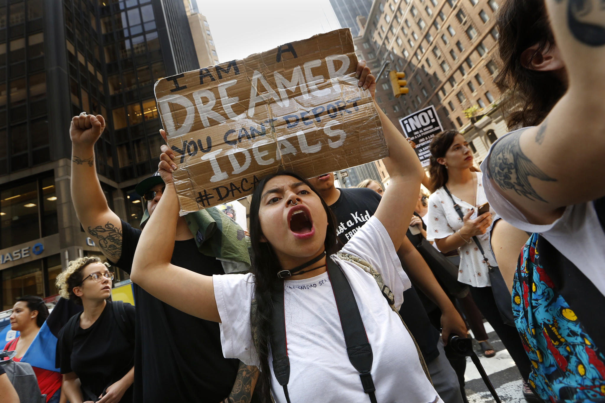 Protesters, including Dreamer Gloria Mendoza, gather at Trump Tower in New York to protest the announcement that President Trump will end the Deferred Action for Childhood Arrivals program. (Carolyn Cole / Los Angeles Times)