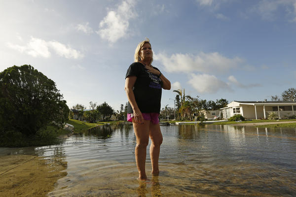 Sue Przybylski stands in shallow water near her home in Naples, Fla. (Carolyn Cole/Los Angeles Times)