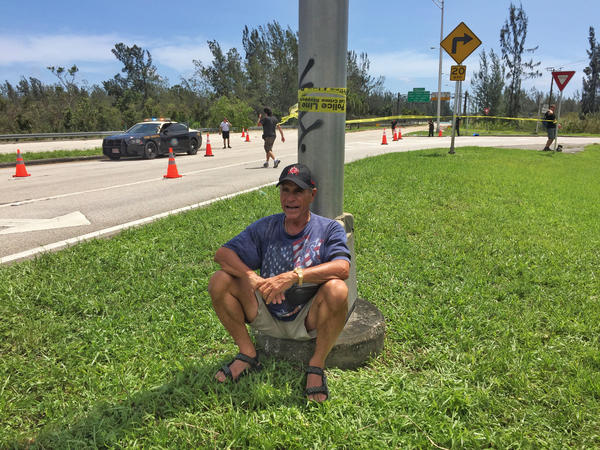 Warren Stincer waits at a checkpoint along Route 1, the only road going in and out of the Florida Keys on Monday. (Marcus Yam / Los Angeles Times)
