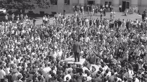 Mario Savio stands atop a police car in front of Sproul Hall on Oct. 1, 1964.
