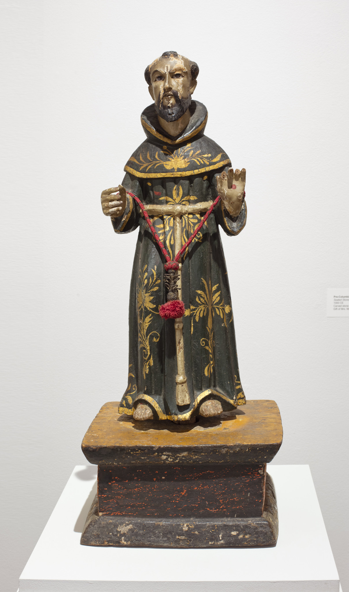 A carving of a priest made during the Spanish colonial era in California (c. 1725), part of "Sacred Art in the Age of Contact."