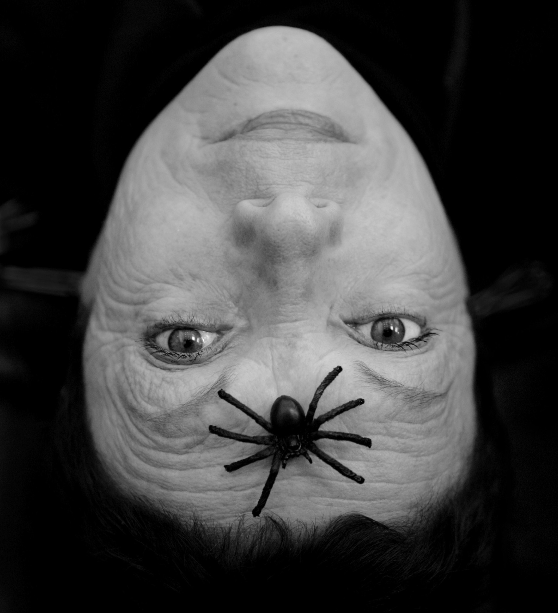 Mexican artist Graciela Iturbide playing around with a plastic spider in Los Angeles in 2007.