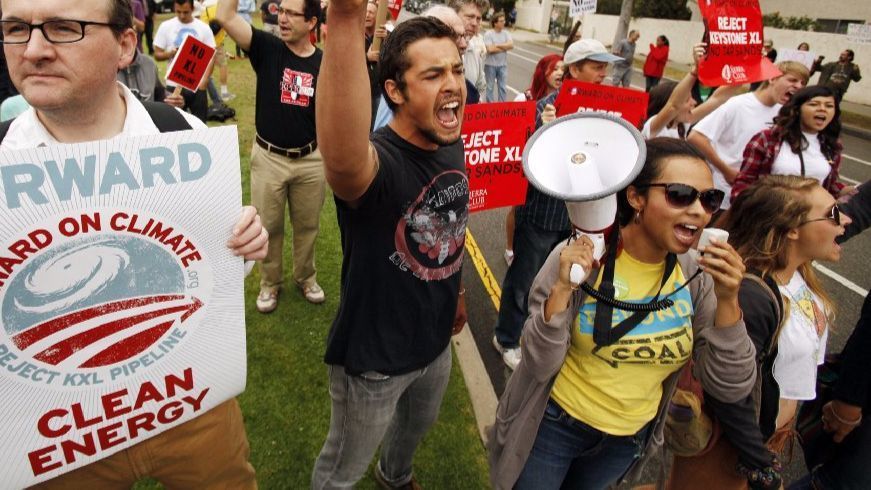Aura Vasquez, with megaphone, leads chants during a 2013 march on L.A.'s Westside protesting the Keystone XL pipeline.