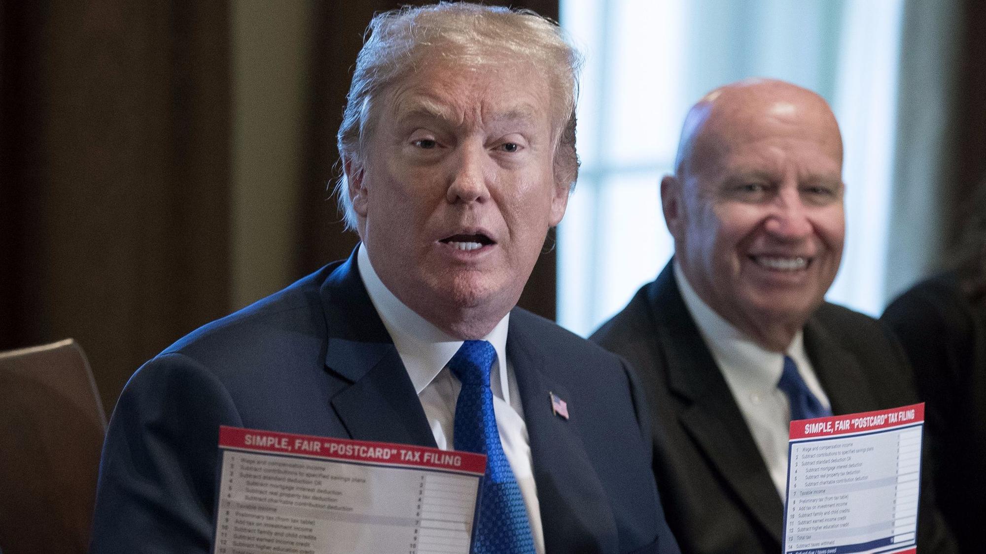 President Trump meets with Rep. Kevin Brady of Texas, right, and other House Republicans last week.