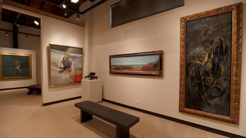 Buck never lost his taste for florid Baroque framing, even on Expressionist paintings by, from left, Nathan Oliveira, Carlos Almaraz and Wolfgang Paalen. A small Peter Voulkos bronze stands on a pedestal at the center.