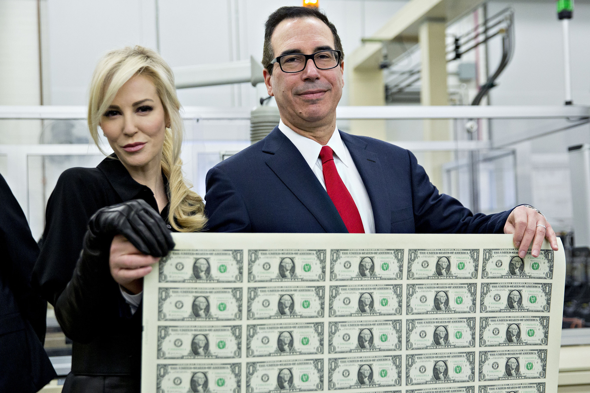 Internet Mocks Treasury Secretary And His Wife For Posing With A Sheet