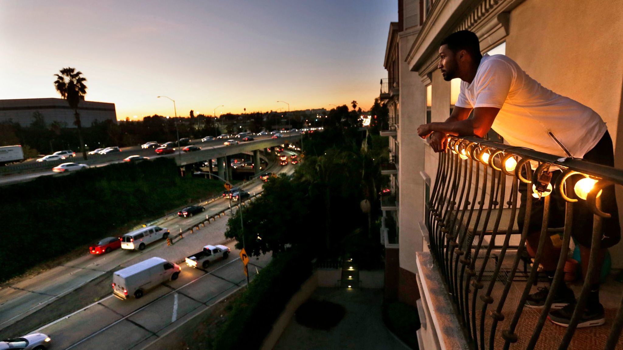 NOVEMBER 18, 2015. LOS ANGELES, CA. Everett Smith, 30, a renter at The Orsini apartments looks out