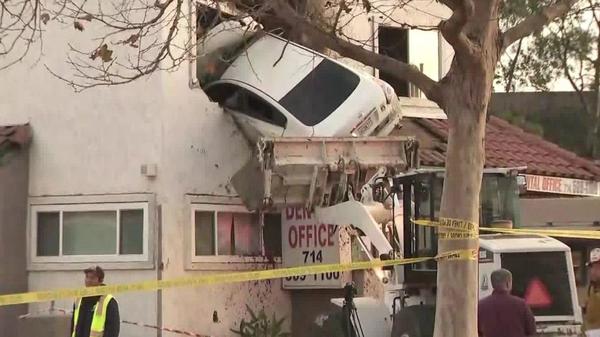 Image result for Car soars into second floor of California building in bizarre crash; 2 hurt