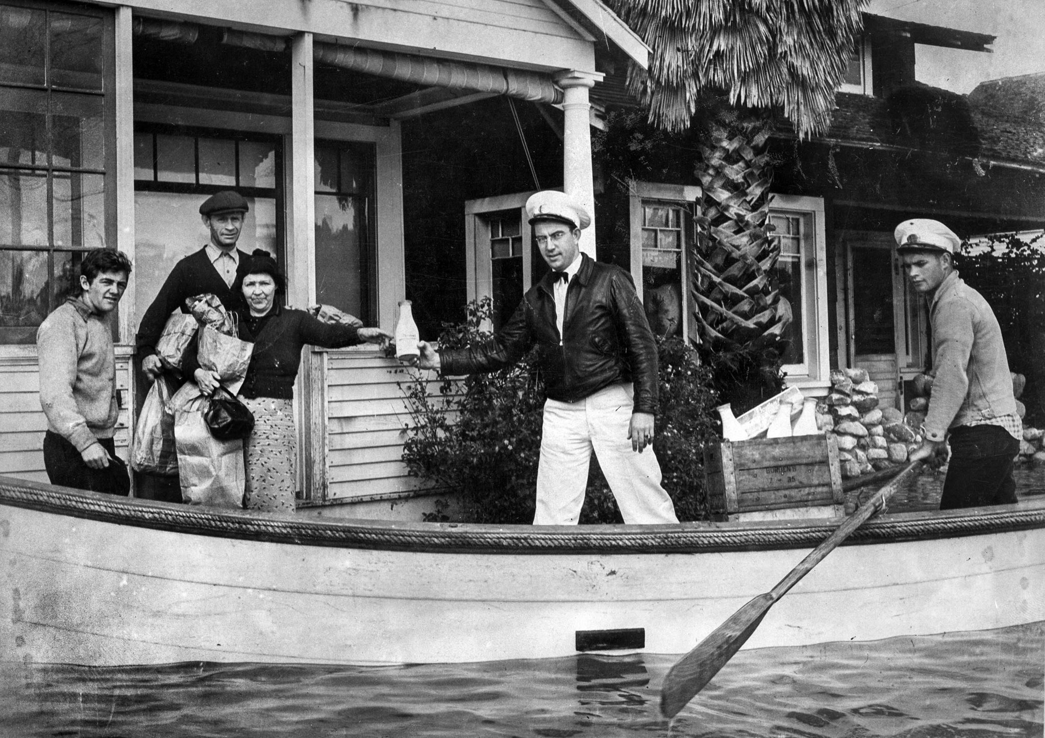 March 3, 1938: Milkman Ray J. Henville secured himself a boat and boatman and made all deliveries on