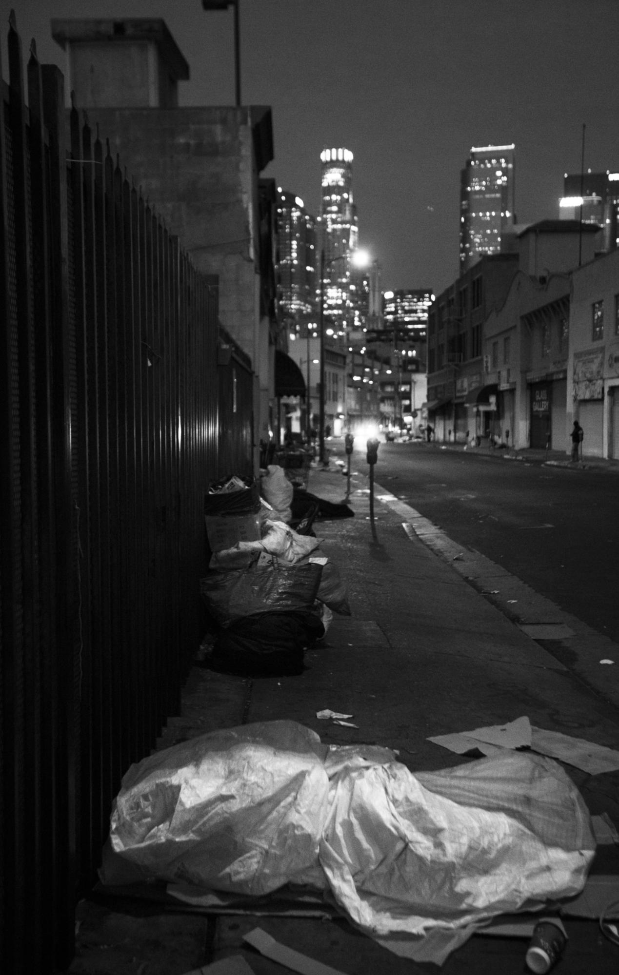 People sleeping on the sidewalk