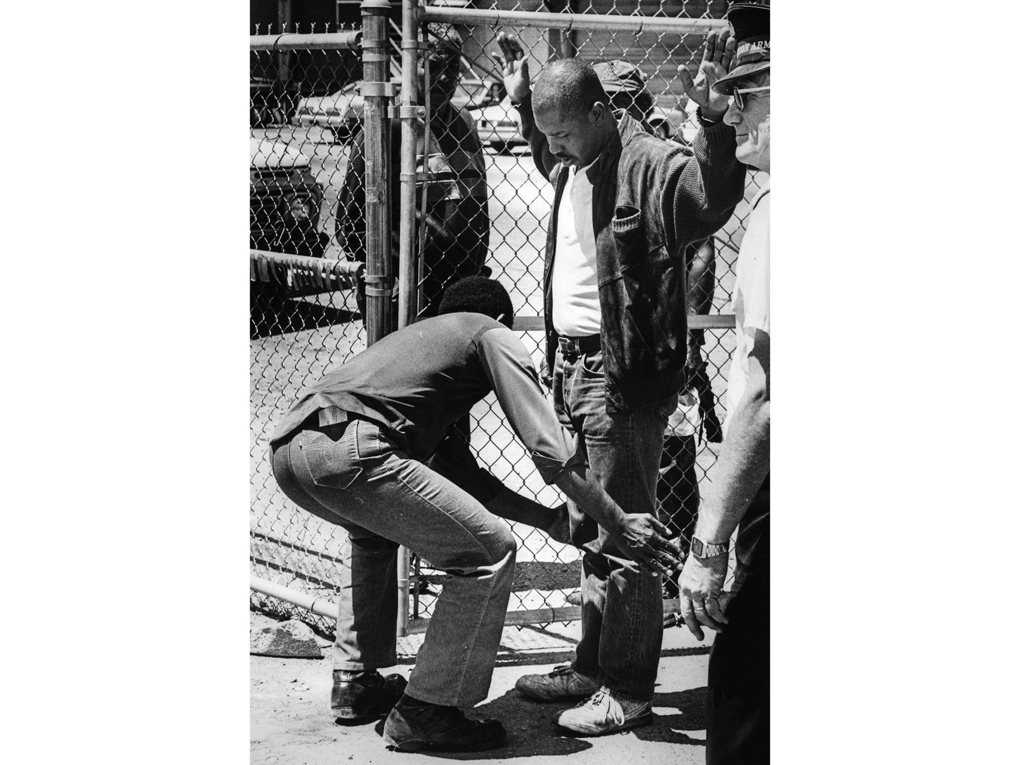 June 15, 1987: A man is searched for concealed weapons and contraban at entrance of the Urban Campgr
